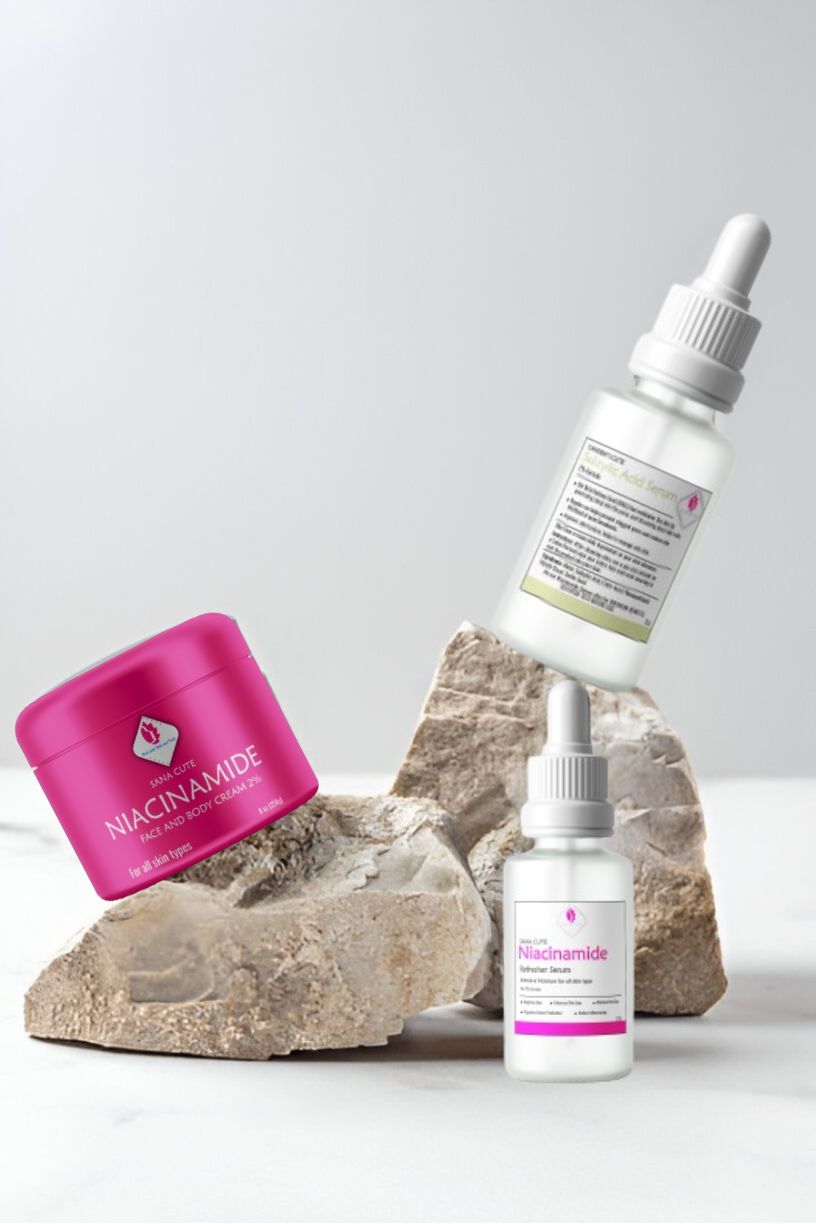 Pink Lady Bath and Body skincare products: Niacinamide face and body cream in a pink jar and two serum dropper bottles, promoting healthy, glowing skin.